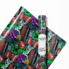 Close-up of green Minecraft wrapping paper with a repeating pattern of the iconic Creeper mob. Ideal for wrapping gifts for fans of the explosive in-game character.