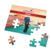 Close-up of a puzzle piece with a player's Roblox username printed on it.