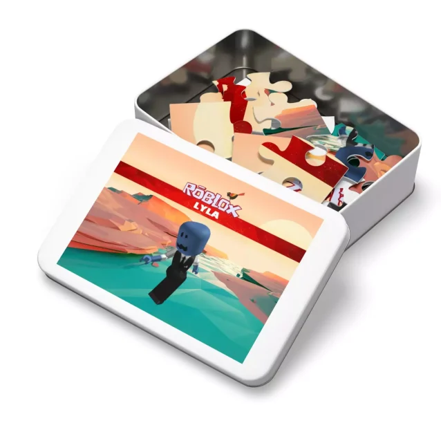 A child proudly holding up their completed 110-piece Roblox avatar puzzle.