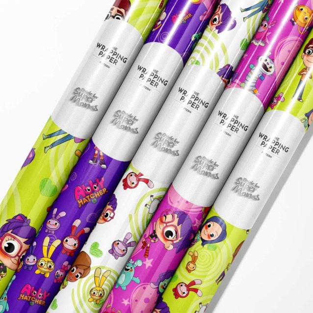 Stack of presents beautifully wrapped in various Abby Hatcher wrapping paper designs.