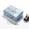 Baby Shark, Mommy Shark, and Daddy Shark illustrated on gift wrapping paper.