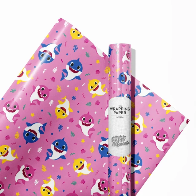 A brightly wrapped gift using Baby Shark character wrapping paper.