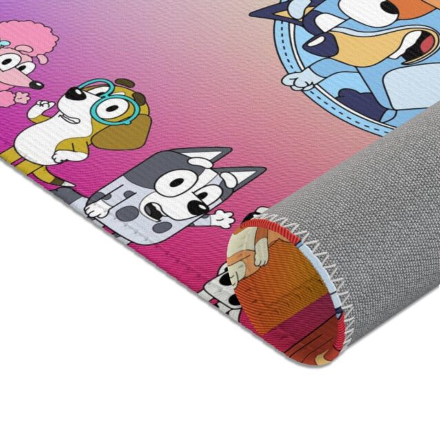 Laid out for playtime, a Bluey area rug you can personalize with a name, Bluey and Bingo on non-slip pile