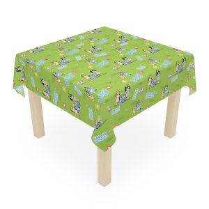 Homemade Duck Cake sitting on a wipeable Bluey themed table surface.