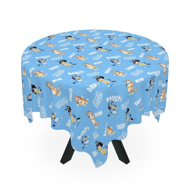 Close-up texture shot of stain-resistant polyester fabric on Bluey party tablecloth.