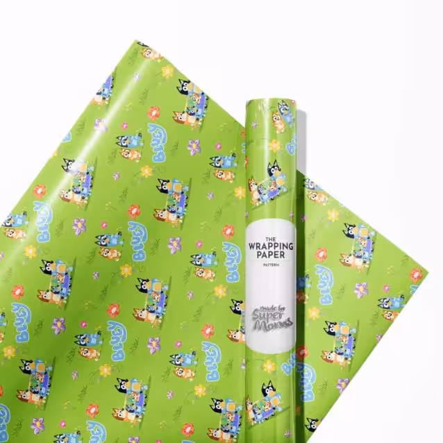 Close-up of Bluey wrapping paper showing the glossy finish and colourful Heeler family print.