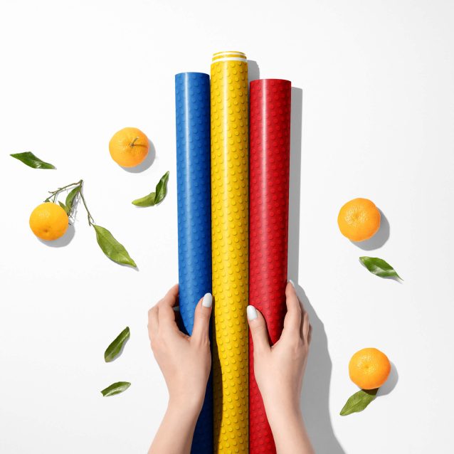 Lego wrapping paper with a construction theme print.