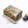 Roll of vibrant Lego wrapping paper featuring colorful Lego bricks.