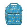 Bright blue Cocomelon diaper bag with rainbows, clouds and watermelon icons.