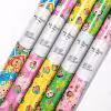 "Roll of vibrant Cocomelon wrapping paper featuring JJ and animal friends."