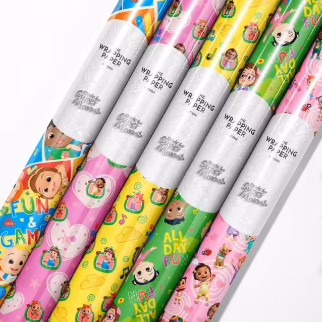 "Roll of vibrant Cocomelon wrapping paper featuring JJ and animal friends."