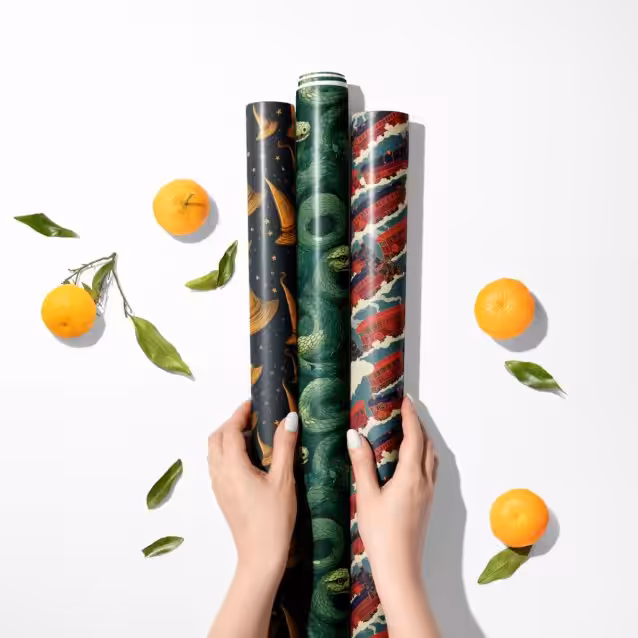 Multiple rolls of Harry Potter themed Christmas wrapping paper in various sizes.