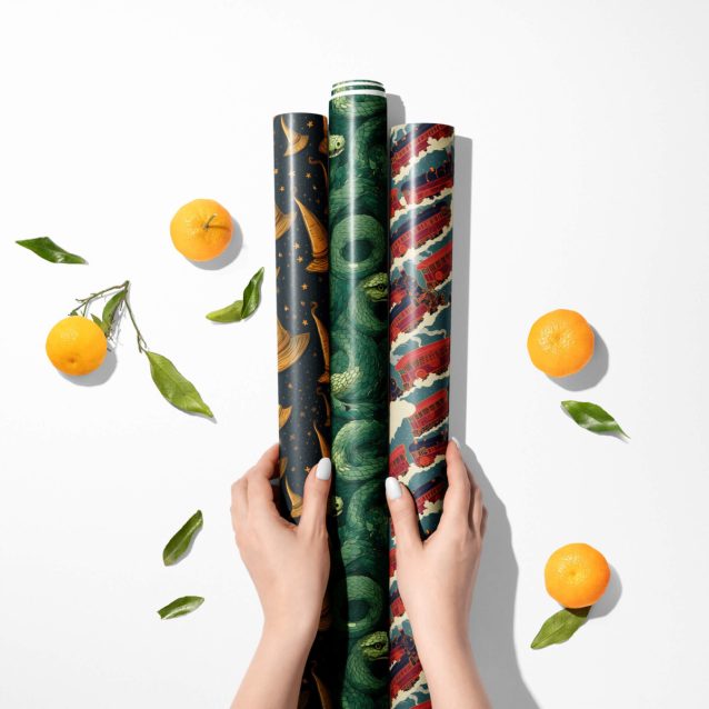 Multiple rolls of Harry Potter themed Christmas wrapping paper in various sizes.
