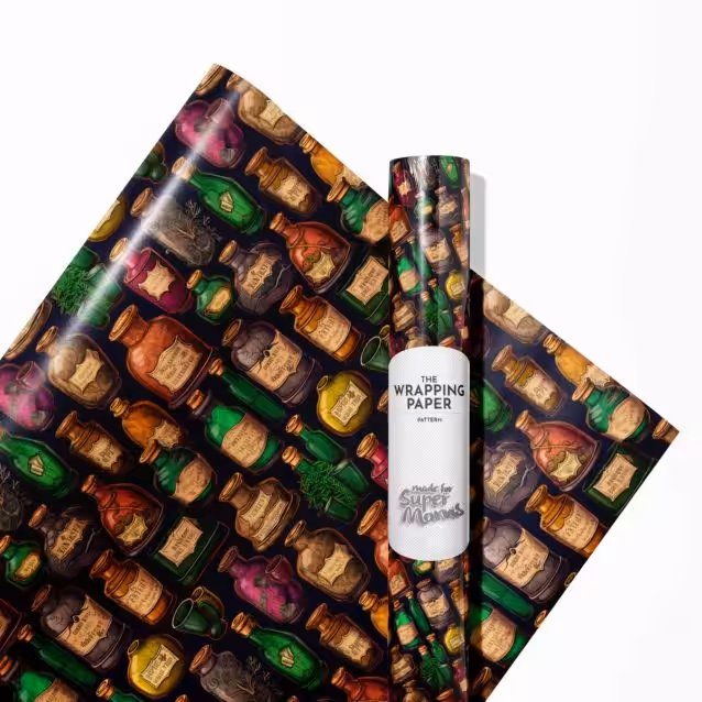 Hand wrapping a gift using a roll of magical Harry Potter Christmas wrapping paper.