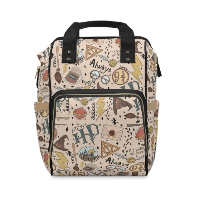 Cream Harry Potter diaper backpack with wizarding doodle art and black handles.