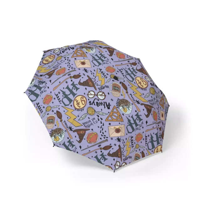 Harry Potter Hogwarts Doodles (Purple) umbrella held open in the rain.