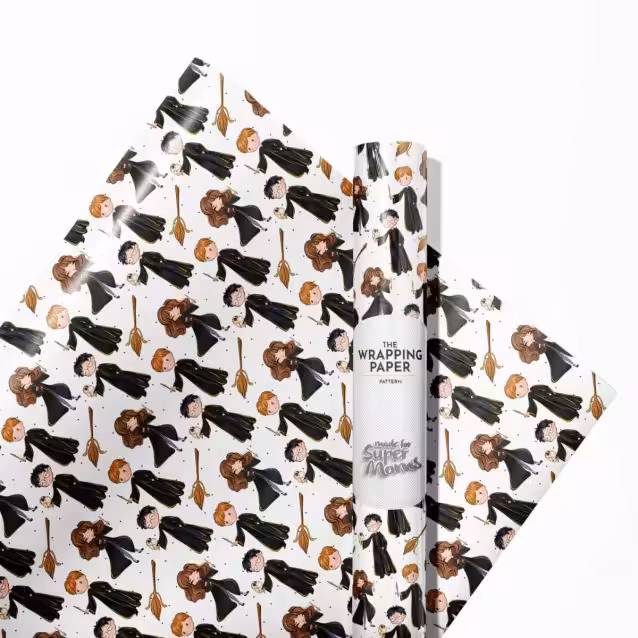 Child excitedly looking at a gift wrapped in colorful Harry Potter paper.