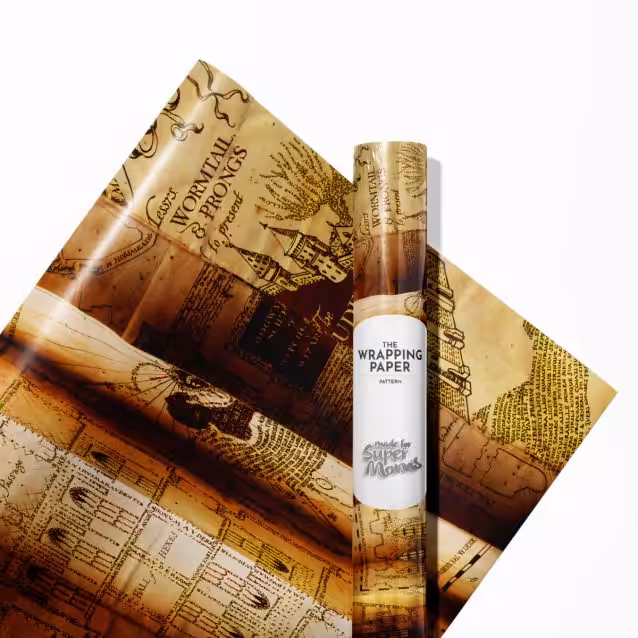 A neatly wrapped gift using Harry Potter wrapping paper, tied with a gold ribbon.