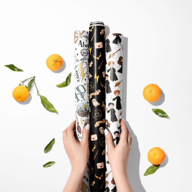 Close-up of Harry Potter gift wrap showcasing vibrant illustrations of Harry, Ron, and Hermione.