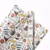 Several rolls of Harry Potter themed wrapping paper in various sizes.