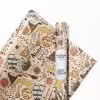 Harry Potter birthday wrapping paper with "Happy Birthday" text and magical elements.