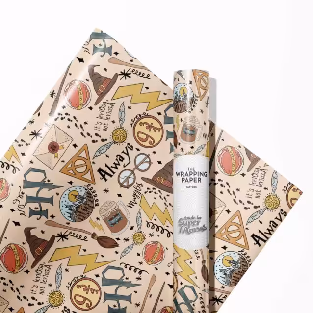 Harry Potter birthday wrapping paper with "Happy Birthday" text and magical elements.