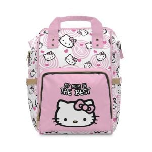 Personalized pink Hello Kitty nappy bag sitting open next to a changing pad, baby toys, and folded nursery clothes.