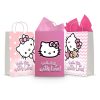 Three printable Hello Kitty goodie bag fronts on paper party bags — Kitty on pink polka dots, a bold magenta close-up of her face, and Kitty with her teddy bear on pink chevron, each with the "Hello Kitty with Love!" script.