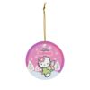 Angel Kitty in a green fairy dress over a pink winter sky - personalized Hello Kitty Christmas ornament with name and year