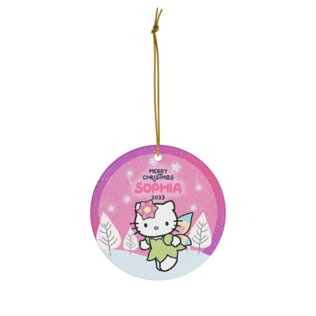 Angel Kitty in a green fairy dress over a pink winter sky - personalized Hello Kitty Christmas ornament with name and year