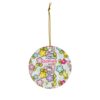 Colorful flower garden pattern with Hello Kitty among blooms on this custom name Christmas ornament