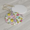 Colorful flower garden pattern with Hello Kitty among blooms on this custom name Christmas ornament
