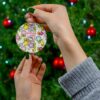 Colorful flower garden pattern with Hello Kitty among blooms on this custom name Christmas ornament