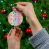 Pastel rainbow stripe pattern dotted with tiny Kitties - personalized Christmas ornament with name and year