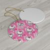 Repeating pink Hello Kitty pattern on a round personalized Christmas ornament for kids