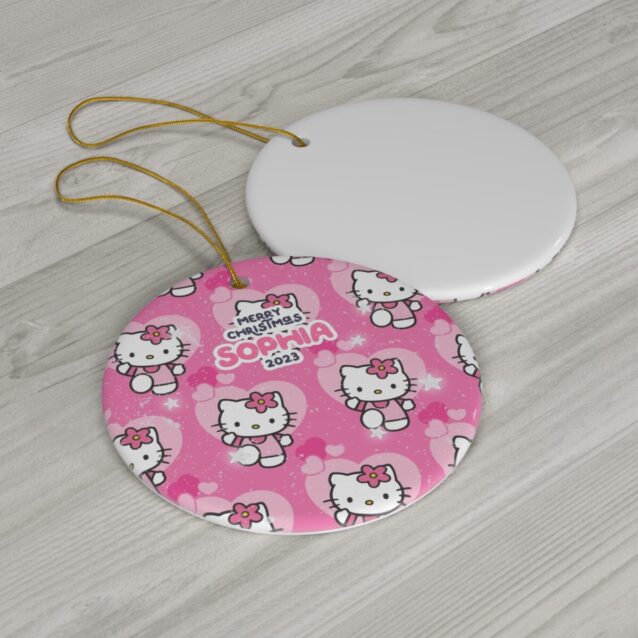 Repeating pink Hello Kitty pattern on a round personalized Christmas ornament for kids
