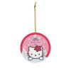 Kitty peeking over a snowy ledge with her red flower bow - personalized Christmas tree ornament