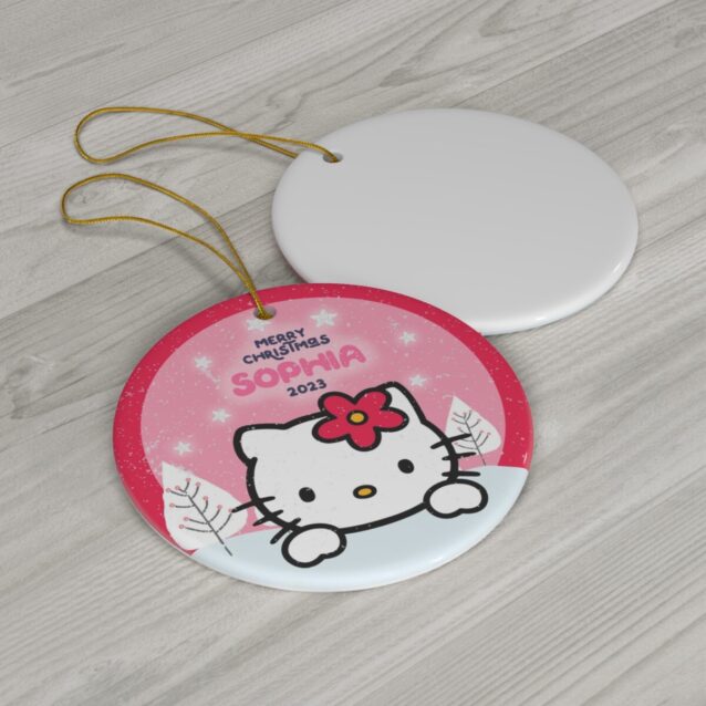 Kitty peeking over a snowy ledge with her red flower bow - personalized Christmas tree ornament