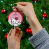 Kitty peeking over a snowy ledge with her red flower bow - personalized Christmas tree ornament