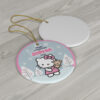 Hello Kitty in a red dress holding her teddy in a blue winter village - custom name Christmas ornament