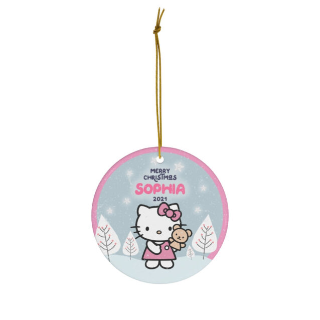 Hello Kitty in a red dress holding her teddy in a blue winter village - custom name Christmas ornament