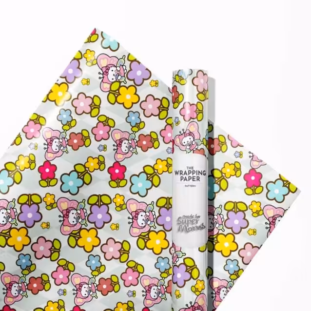 Heroic pose of Hello Kitty on a colorful wrapping paper background.