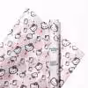 Hello Kitty birthday wrapping paper featuring Hello Kitty with a birthday cake.