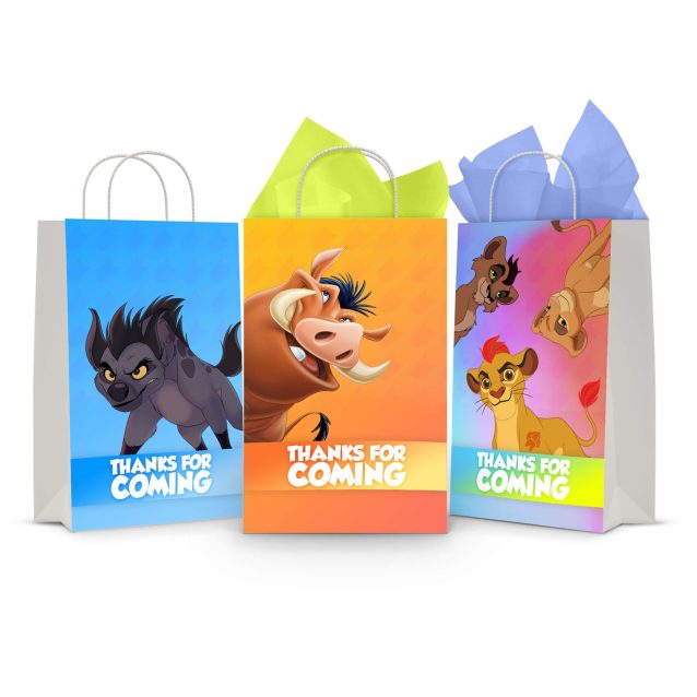 Three printable Lion King goodie bag fronts on paper party bags — a hyena on blue, Pumbaa the warthog on orange, and the lion cubs together, each with the "Thanks For Coming" banner.