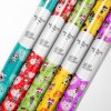 LOL Wrapping Paper roll next to an LOL Surprise doll for theme consistency.