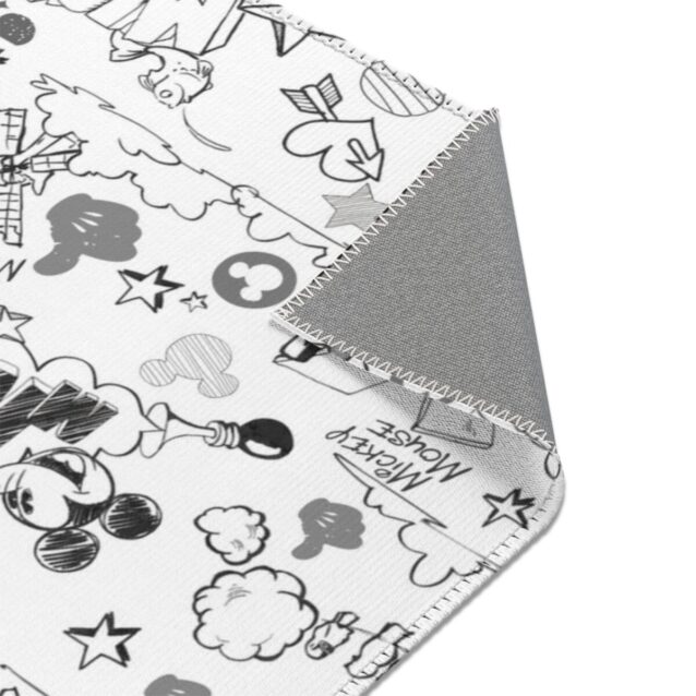A child playing on the soft polyester Mickey Mouse area rug, perfect for a playroom or bedroom.