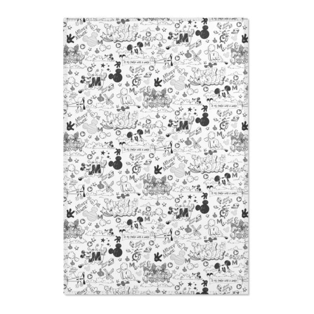 A Mickey Mouse rug brightening a sunlit playroom, soft printed pile for cozy floor play.