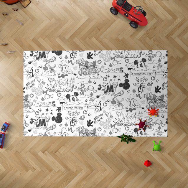 A close-up of the soft, black and white Mickey Mouse rug design.