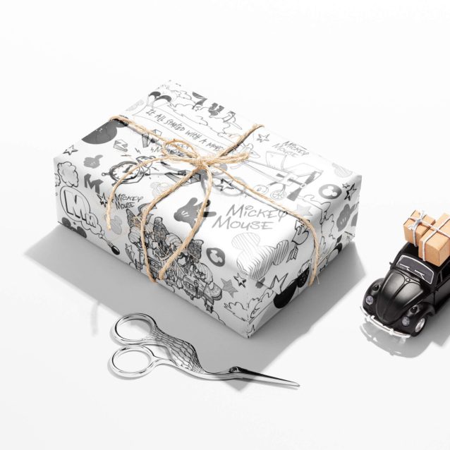 Themed gift wrap showing Mickey Mouse in heroic and fun poses.