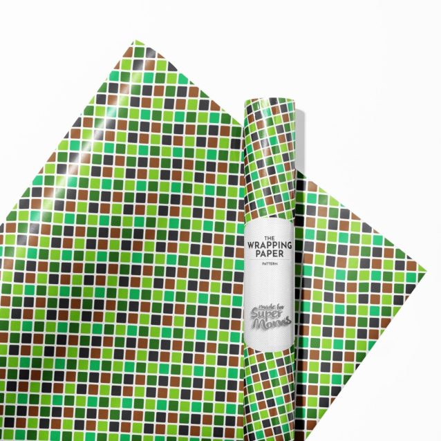 Pixelated landscape design on a roll of Minecraft gift wrap, showing various biomes.